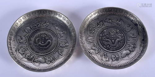 TWO CHINESE WHITE METAL COIN DISHES 20th Century. 8.5