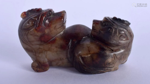 A 19TH CENTURY CHINESE CARVED MUTTON JADE FIGURE OF A