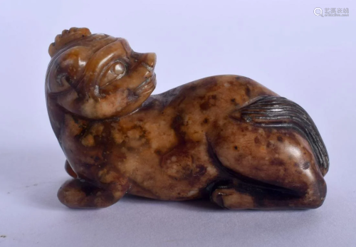 A 19TH CENTURY CHINESE CARVED MUTTON JADE FIGURE OF A