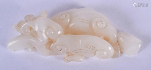AN EARLY 20TH CENTURY CHINESE CARVED WHITE JADE LING…