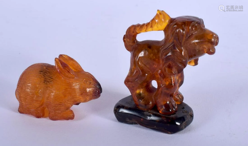 TWO CHINESE CARVED AMBER ANIMALS 20th Century. 23