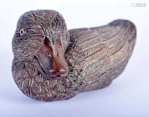 A JAPANESE CARVED BOXWOOD OKIMONO OF A DUCK.…