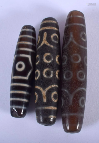 THREE CHINESE AGATE ZHU BEADS 20th Century. 6 cm long.