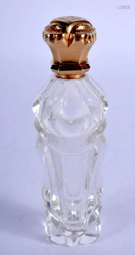 AN ANTIQUE GOLD TOPPED SCENT BOTTLE. 11 cm high.