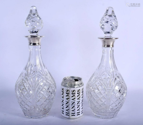 A PAIR OF 1970S ENGLISH MOUNTED SILVER DECANTERS AND