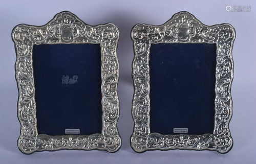 A PAIR OF 1970S ENGLISH SILVER PHOTOGRAPH FRAMES. 22 cm