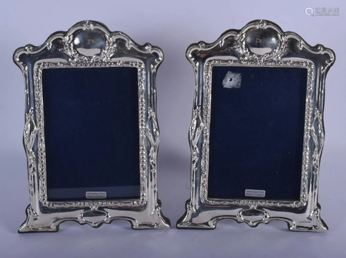 A PAIR OF 1970S ENGLISH SILVER PHOTOGRAPH FRAMES. 22 cm