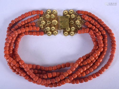 AN 18CT GOLD MOUNTED CORAL NECKLACE. 288 grams. Each