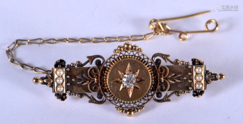 A 15CT GOLD AND DIAMOND BROOCH. 5 grams. 5 cm x 1.5 cm.