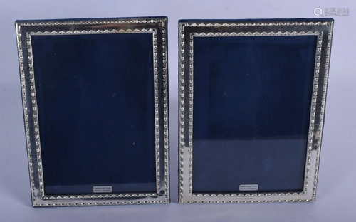 A PAIR OF 1970S ENGLISH SILVER PHOTOGRAPH FRAMES. 22 cm