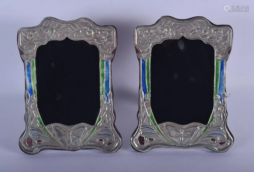 A PAIR OF SILVER AND ENAMEL PHOTOGRAPH FRAMES. 21 cm x