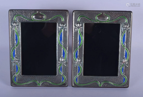 A PAIR OF SILVER AND ENAMEL PHOTOGRAPH FRAMES. 21 cm x