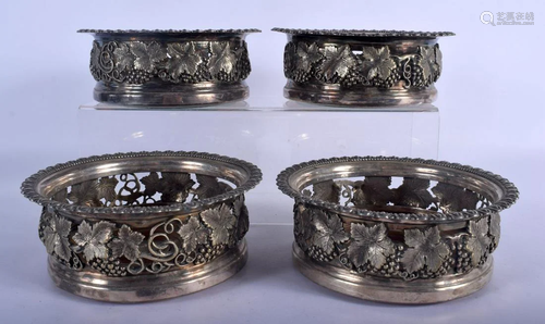 A SET OF FOUR ANTIQUE SILVER PLATED VINE LEAF AND BERRY