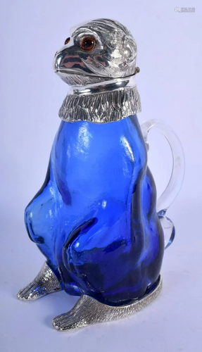 A CONTEMPORARY SILVER PLATED BLUE GLASS MONKEY CLARET