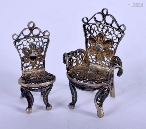 TWO SILVER CHAIRS. 6.9 grams. 3.5 cm x 2.5 cm. (2)