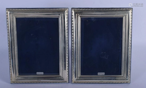 A PAIR OF 1970S ENGLISH SILVER PHOTOGRAPH FRAMES. 22 cm