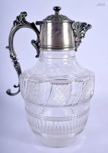 AN ANTIQUE SILVER PLATED CRYSTAL GLASS CLARET JUG. 24