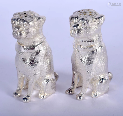 A PAIR OF SILVER PLATED DOG CONDIMENTS. 8 cm x 5 cm.