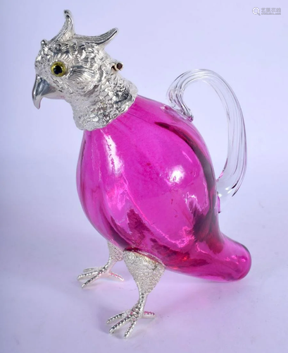 A SILVER PLATED CRANBERRY GLASS PARROT JUG. 16 cm x 13