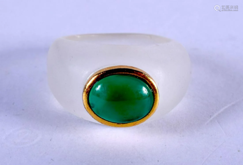 A CRYSTAL GOLD AND JADE RING. N.