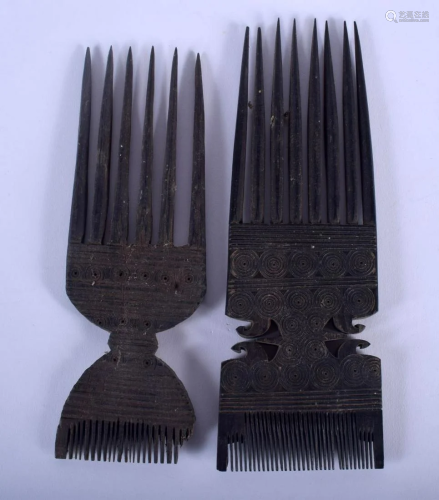 TWO EARLY 20TH CENTURY CARVED TRIBAL PRONGED COMBS. 18