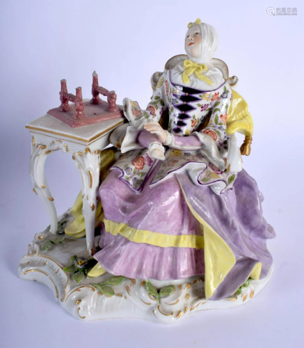 A 19TH CENTURY SITZENDORF PORCELAIN FIGURE OF A SEATED