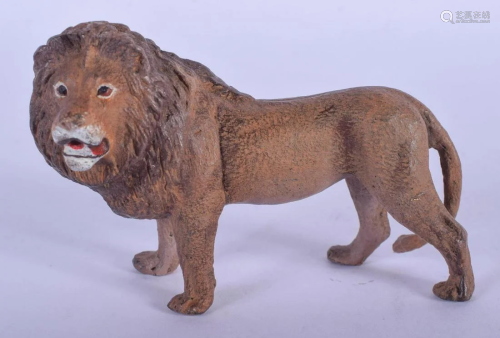 A CONTEMPORARY COLD PAINTED BRONZE LION. 9 cm x 6 cm.