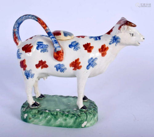 A RARE EARLY 19TH CENTURY WELSH SWANSEA POTTERY COW