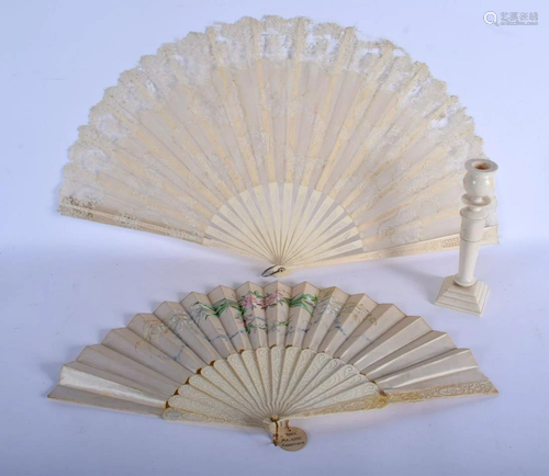 TWO ANTIQUE BONE FANS and a candlestick. Largest 40 cm