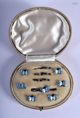 A CASED ART DECO SILVER AND ENAMEL BUTTERFLY BUTTONS.