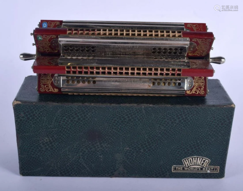 A VINTAGE BOXED HOHNER HARMONICA. 22 cm wide.
