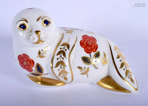 Royal Crown Derby paperweight of a seal. 13.5cm long