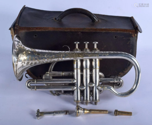A BOXED BOOSEY & CO TRUMPET decorated with foliage. 33