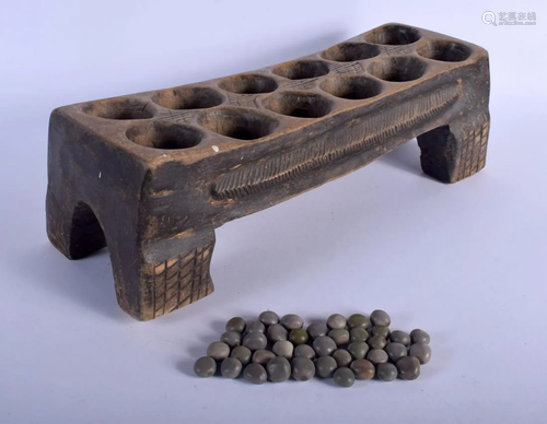 AN AFRICAN MANGALA CARVED WOOD GAMING BOARD …