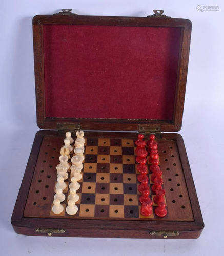 AN ANTIQUE CARVED AND STAINED TRAVELLING CHESS SET. 15