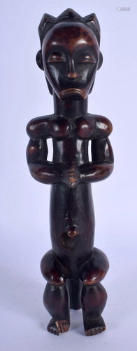 AN EARLY 20TH CENTURY AFRICAN TRIBAL MUSCULAR FIGURE …