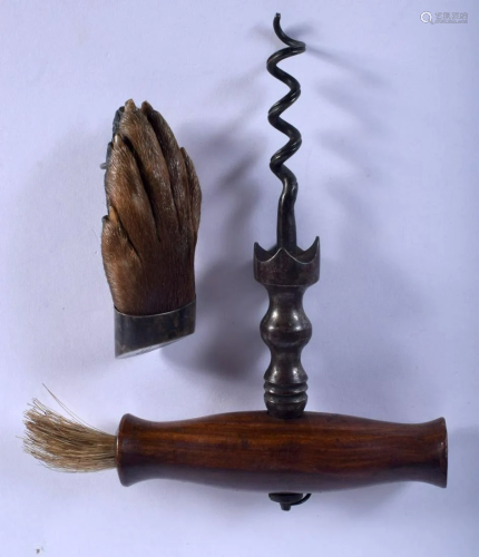AN ANTIQUE CORKSCREW and an antique claw brooch.