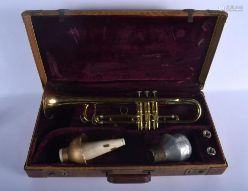 A BOXED FRANK HOLTON & CO BRASS TRUMPET. 43 cm wide.