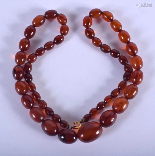 A VINTAGE AMBER TYPE NECKLACE. 31 grams. 56 cm long,