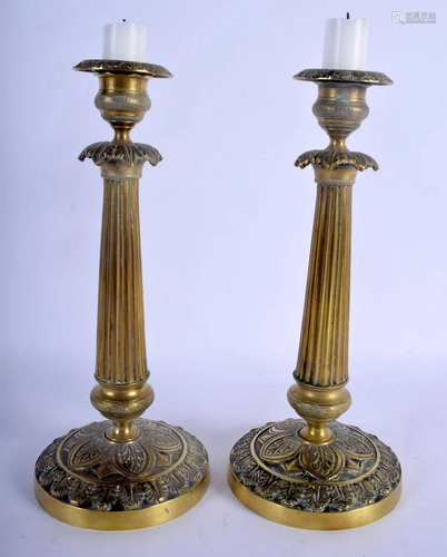 A PAIR OF 19TH CENTURY FRENCH GILT METAL CANDLESTICKS