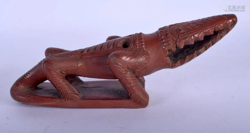 A 19TH CENTURY TURKISH CARVED RED POTTERY CROCODILE