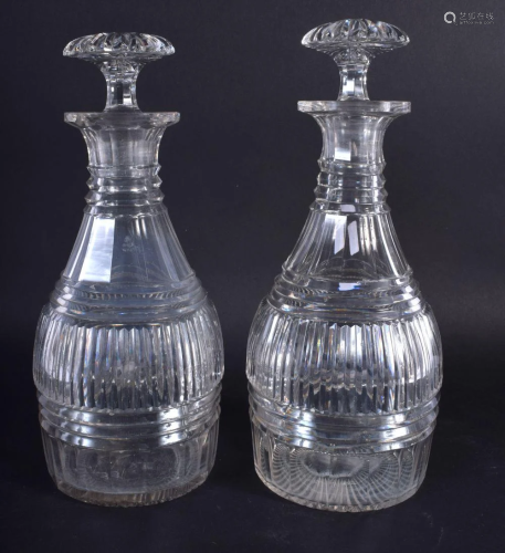 A PAIR OF GEORGE III CUT GLASS DECANTERS. 22 cm high.