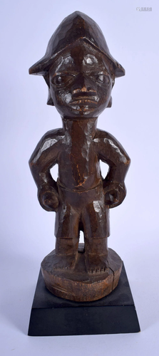 AN AFRICAN TRIBAL YORUBA HARDWOOD FIGURE. 29 cm high