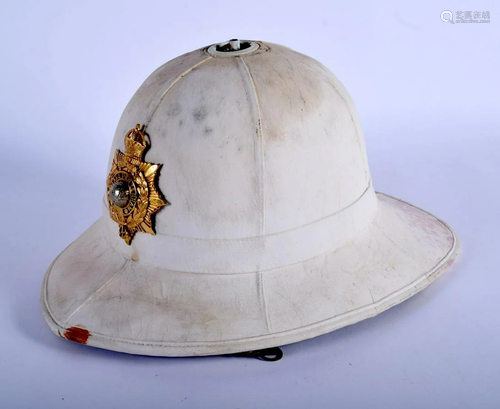 A ROYAL MARINES PITH HELMET with Kings Crown Officers