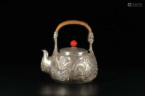chinese silver teapot with dragon pattern