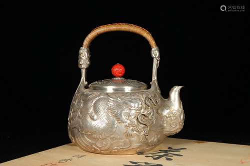 chinese silver teapot with dragon pattern