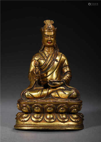 A GILDED BRONZE GURU BUDDHIST STATUE