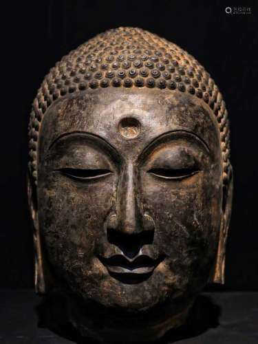 A CLIFF STELE BUDDHA'S HEAD