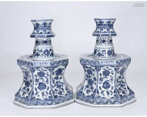 A PAIR OF BLUE AND WHITE CANDLE HOLDERS
