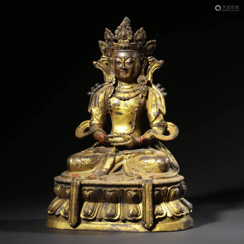 A GILT-BRONZE STATUE OF LONGEVITY BUDDHA